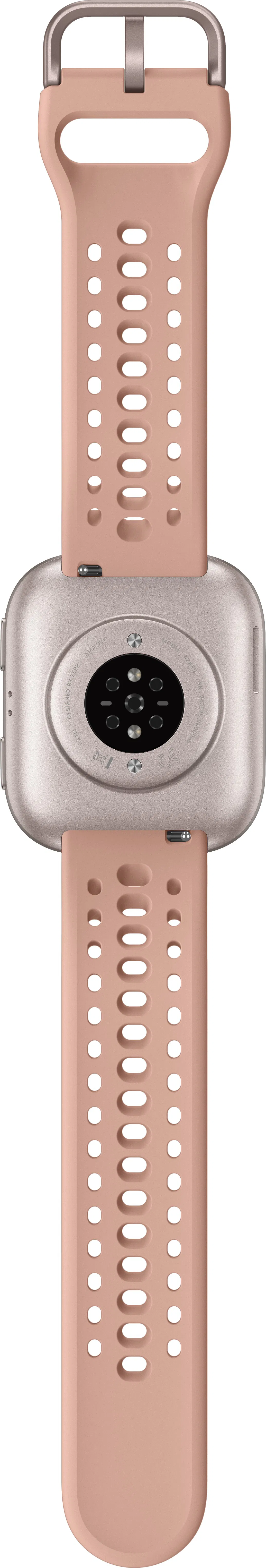 Uno smartwatch con cinturino rosa. Il quadrante è argentato con sensori e testo neri. Il cinturino ha fori.