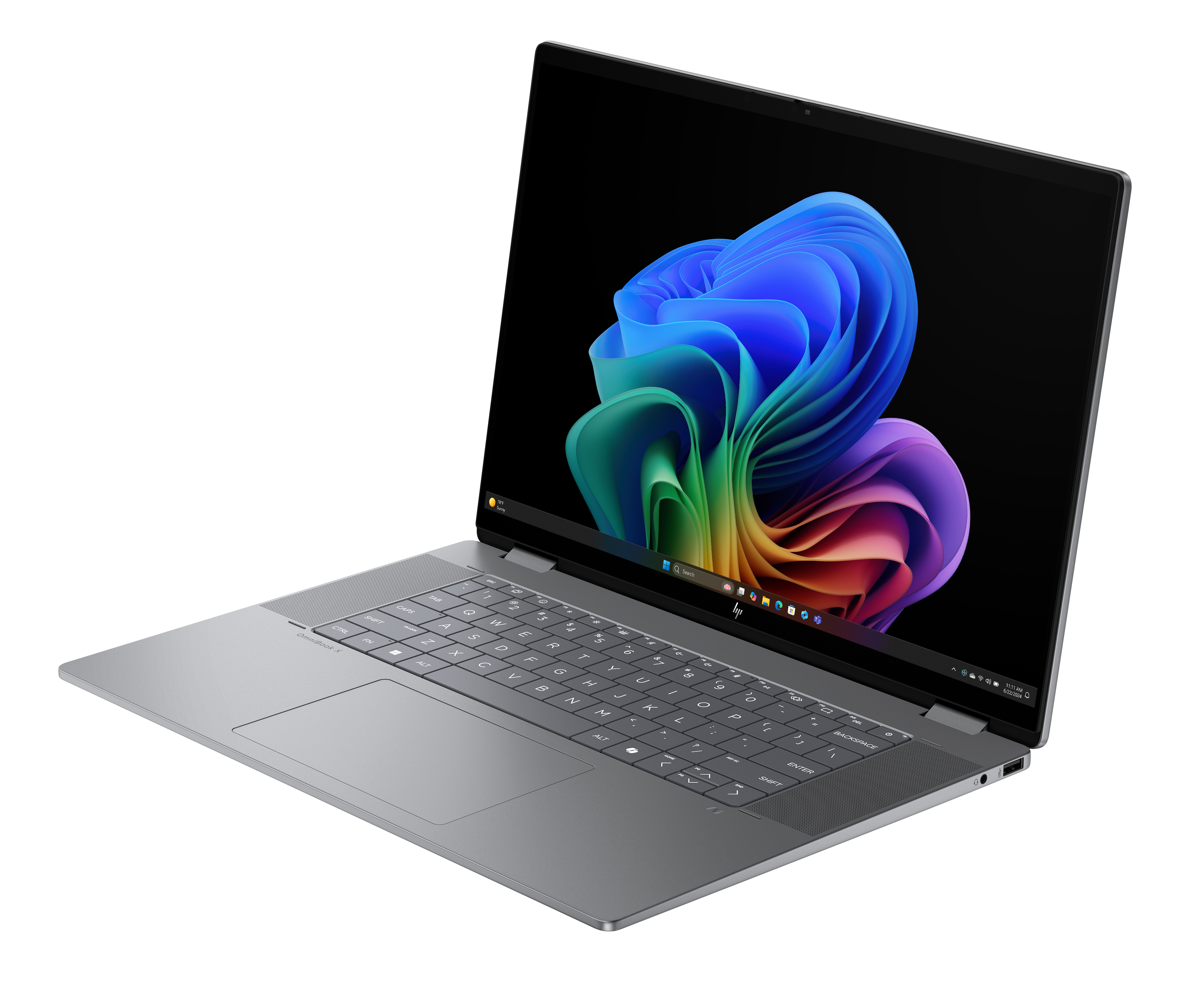 Laptop na czarnym tle, ekran z kolorowym abstrakcyjnym obrazem. Klawiatura i touchpad widoczne. Ujęcie z kąta.