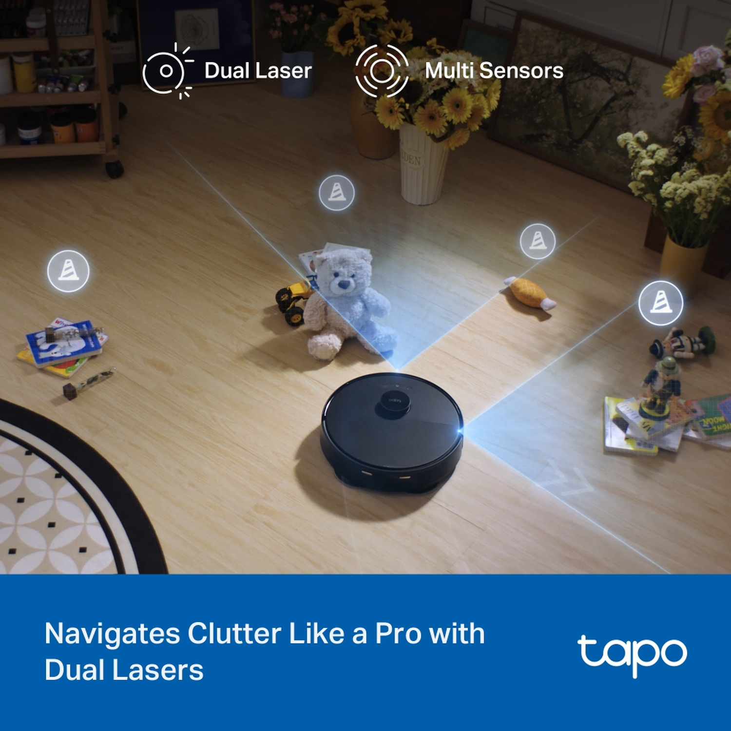 A black robot vacuum cleaner on wood floor, with toys and flowers around. Dual Laser and Multi Sensors are highlighted.