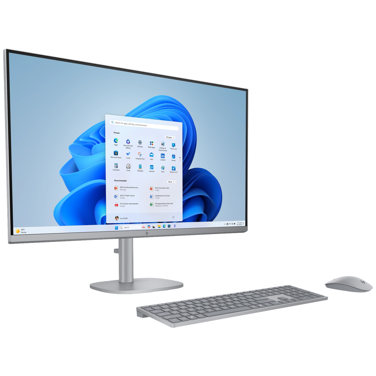 A silver HP all-in-one computer with Windows 11 on screen, keyboard, and mouse.