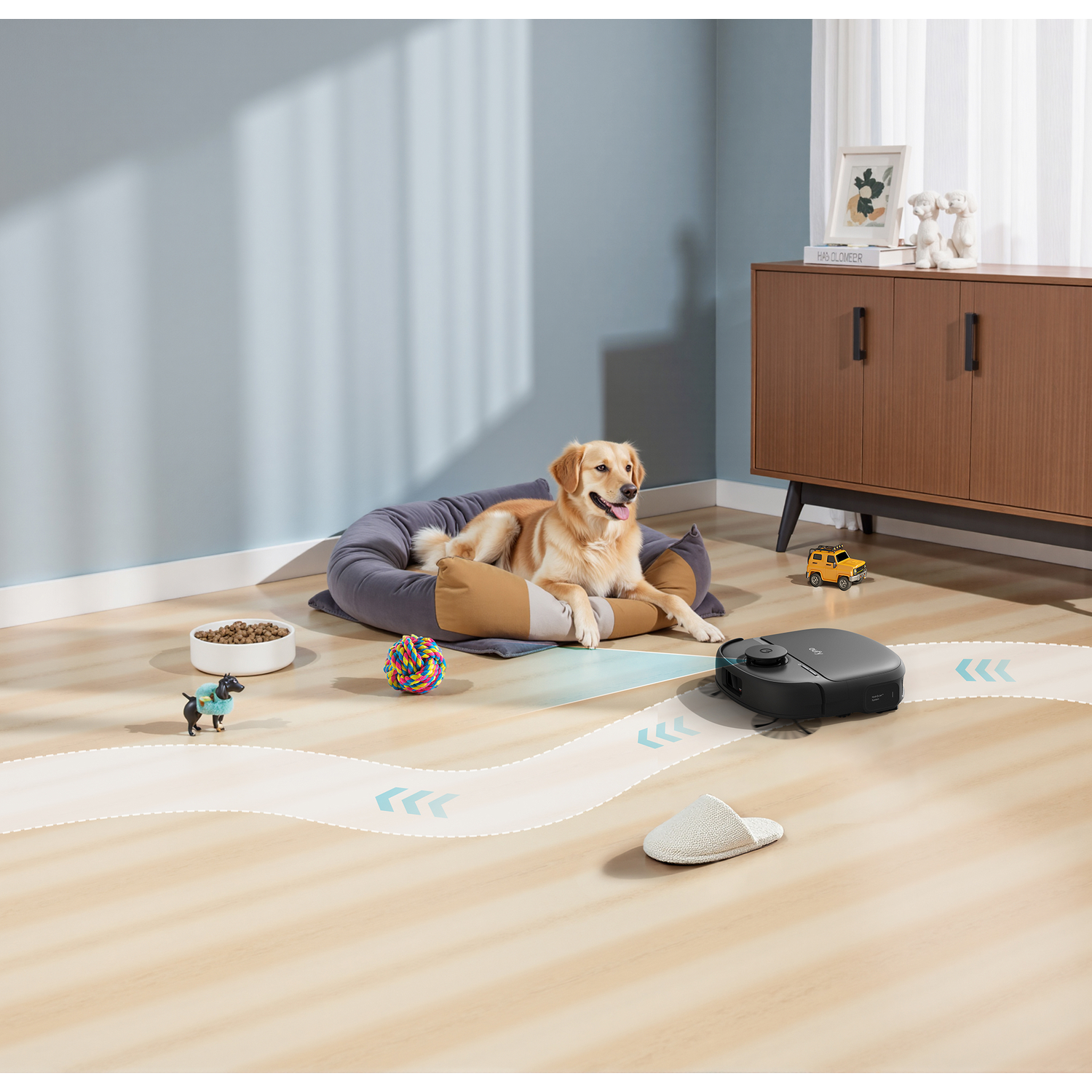 Un golden retriever se repose sur un lit pour chien pendant qu'un aspirateur robot nettoie autour de lui.