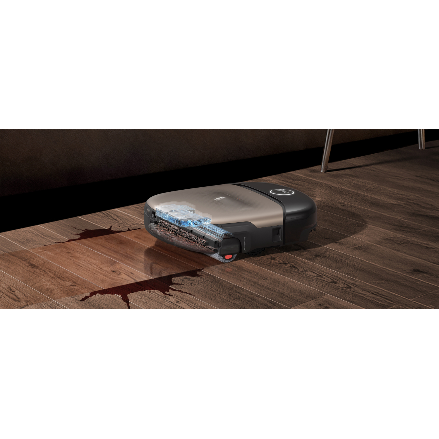 Un aspirateur robot nettoie un déversement sur un parquet.