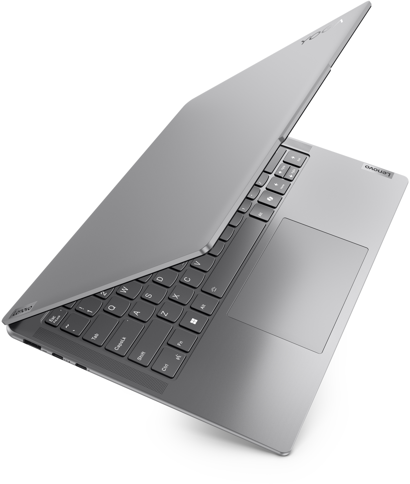 Un ordinateur portable Lenovo Yoga argenté, ouvert, montrant le clavier et le pavé tactile.