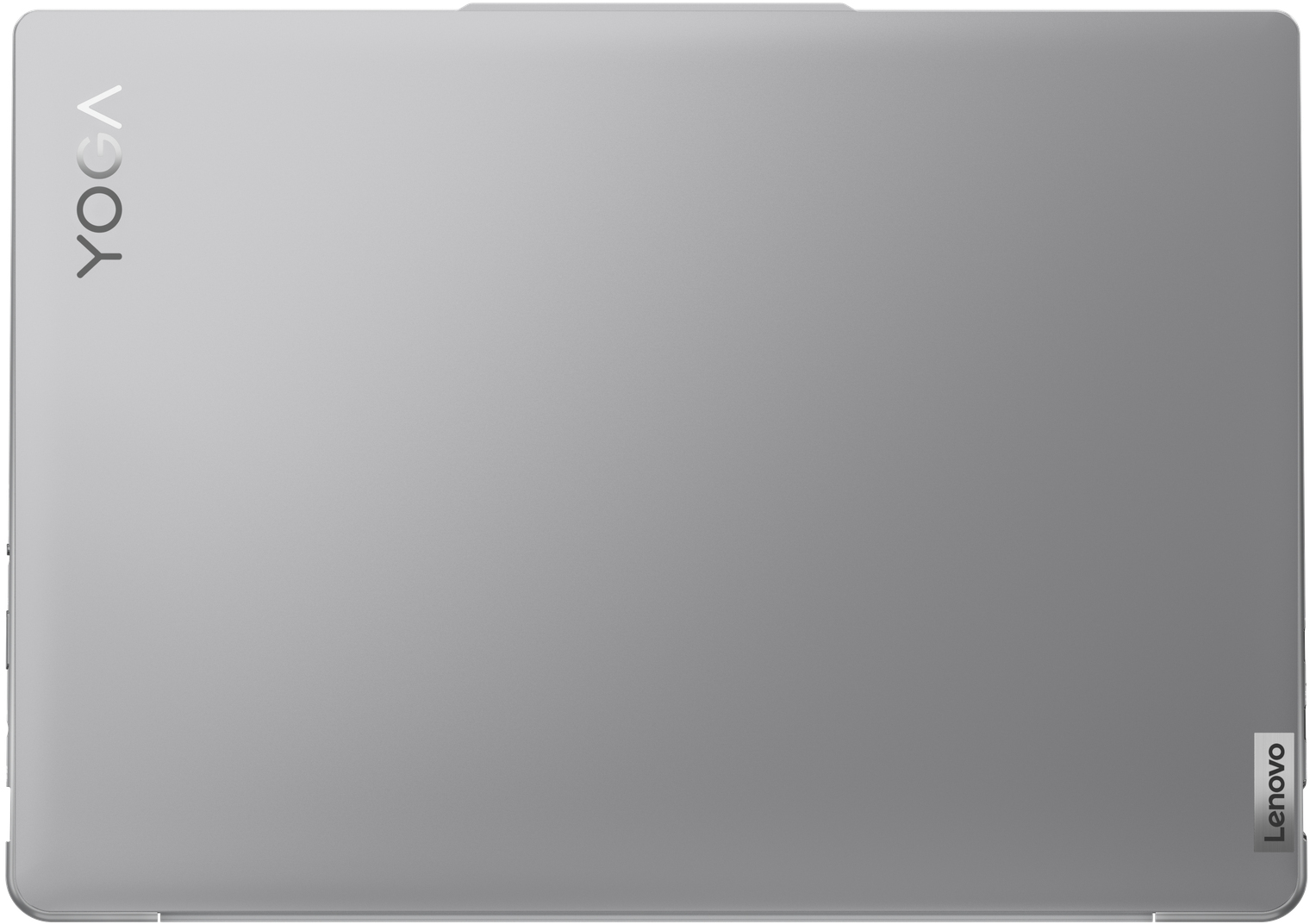 Un ordinateur portable argenté Lenovo Yoga vu de dessus. Le logo Yoga est en haut à gauche.