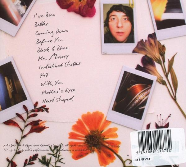 Album-Rückseite listet Lieder, Fotos einer Person, Blumen und Barcode auf.