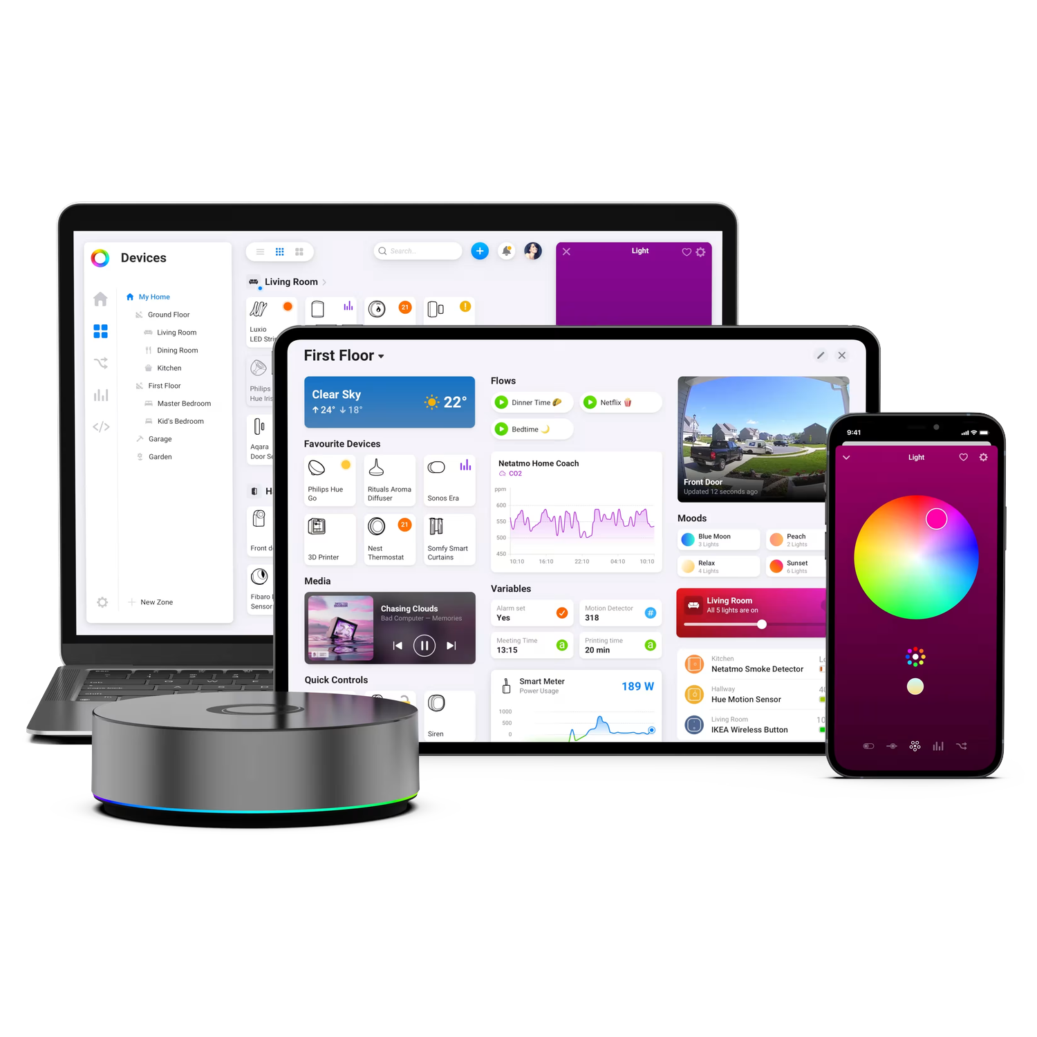 A smart home hub with a laptop, tablet, and phone displaying a smart home app.