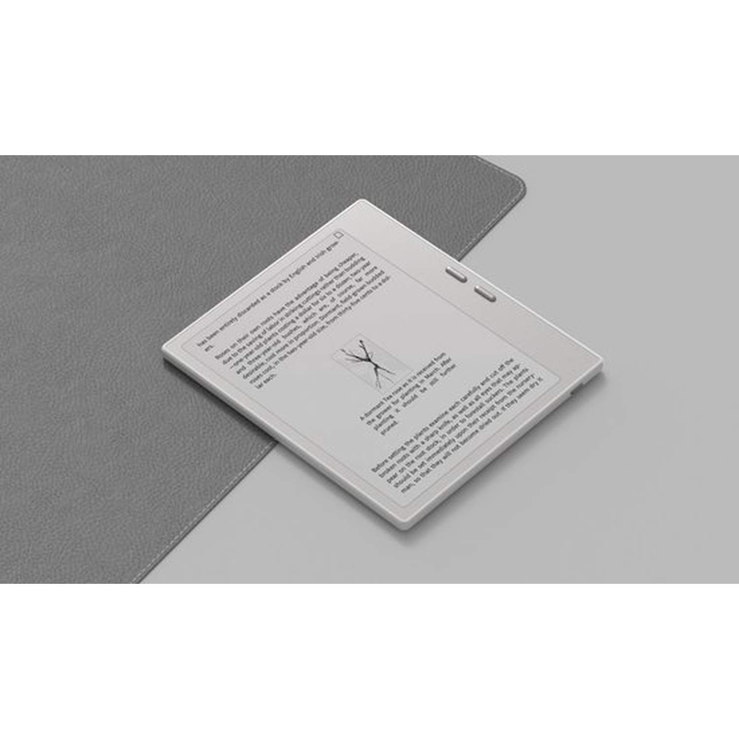 Een wit e-reader-apparaat rust op een grijze ondergrond.