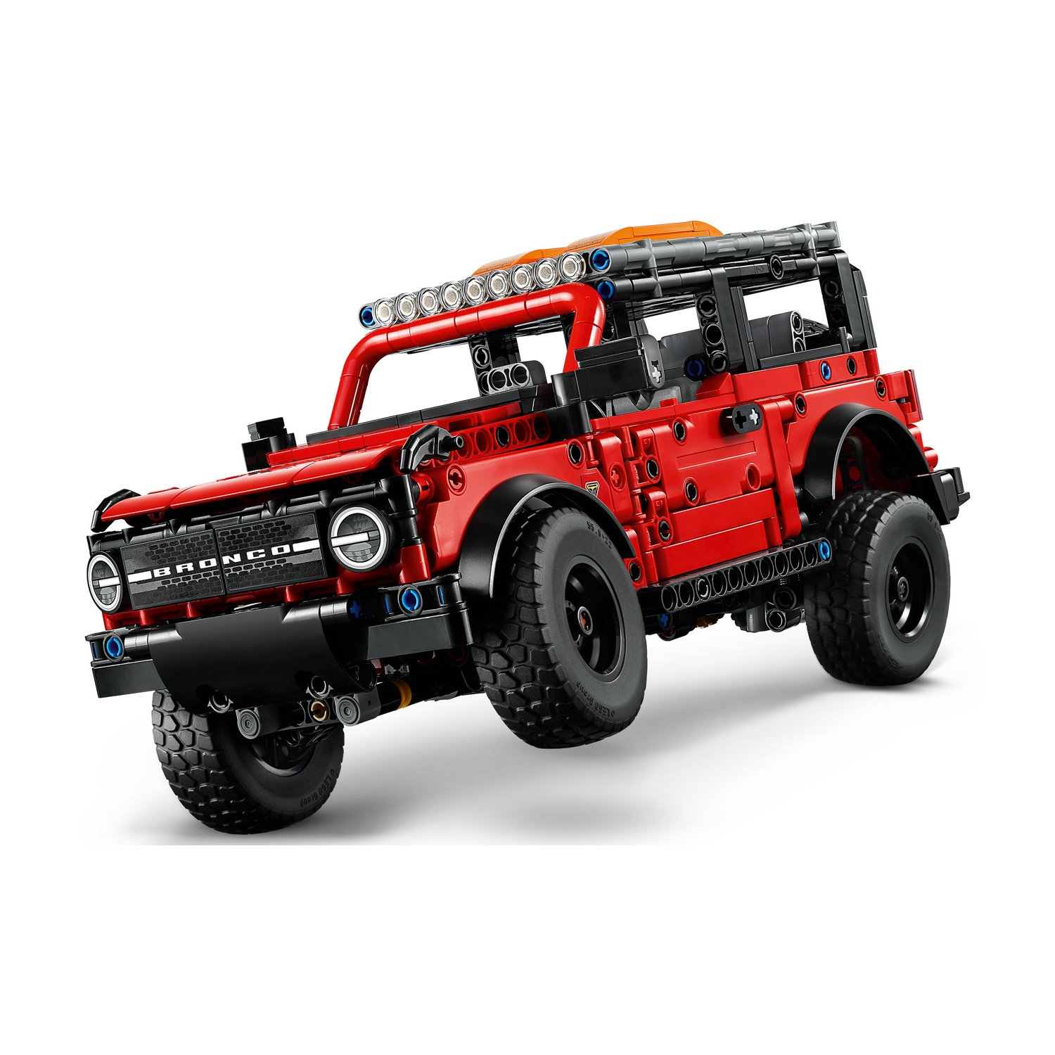 Bronco Lego Technic rosso con ruote nere e portapacchi con luci.