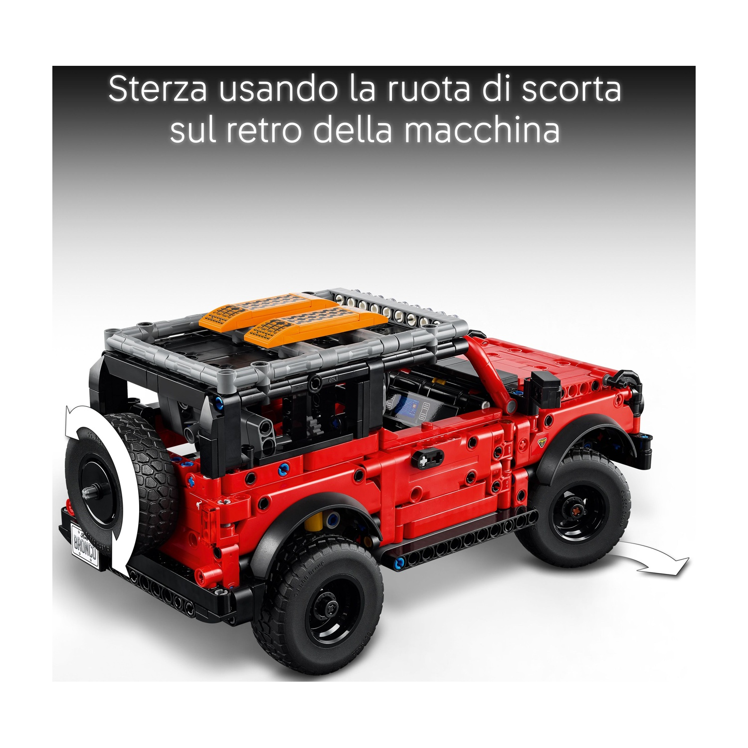 SUV Lego Technic rosso con ruota di scorta posteriore e portapacchi. Freccia indica sterzata.