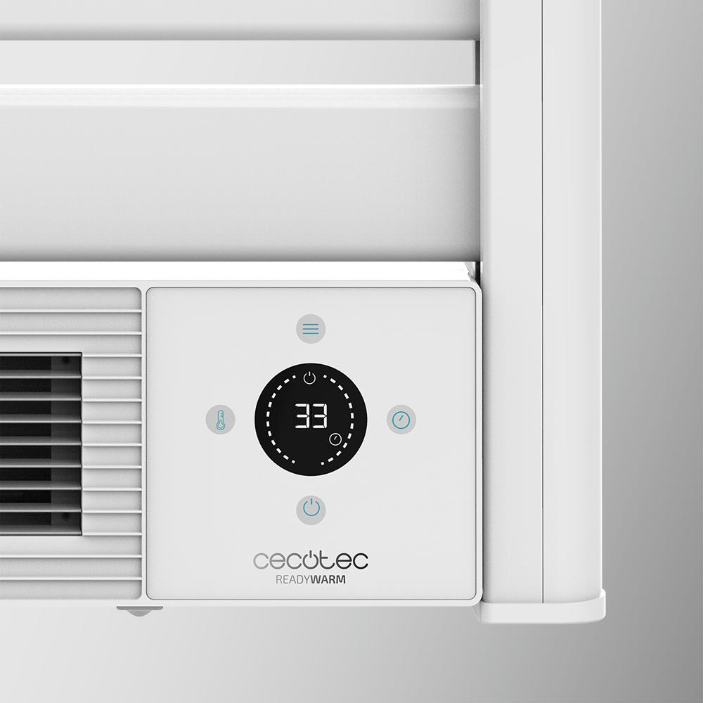 Primer plano del panel de control de un calentador blanco que muestra 33 grados.