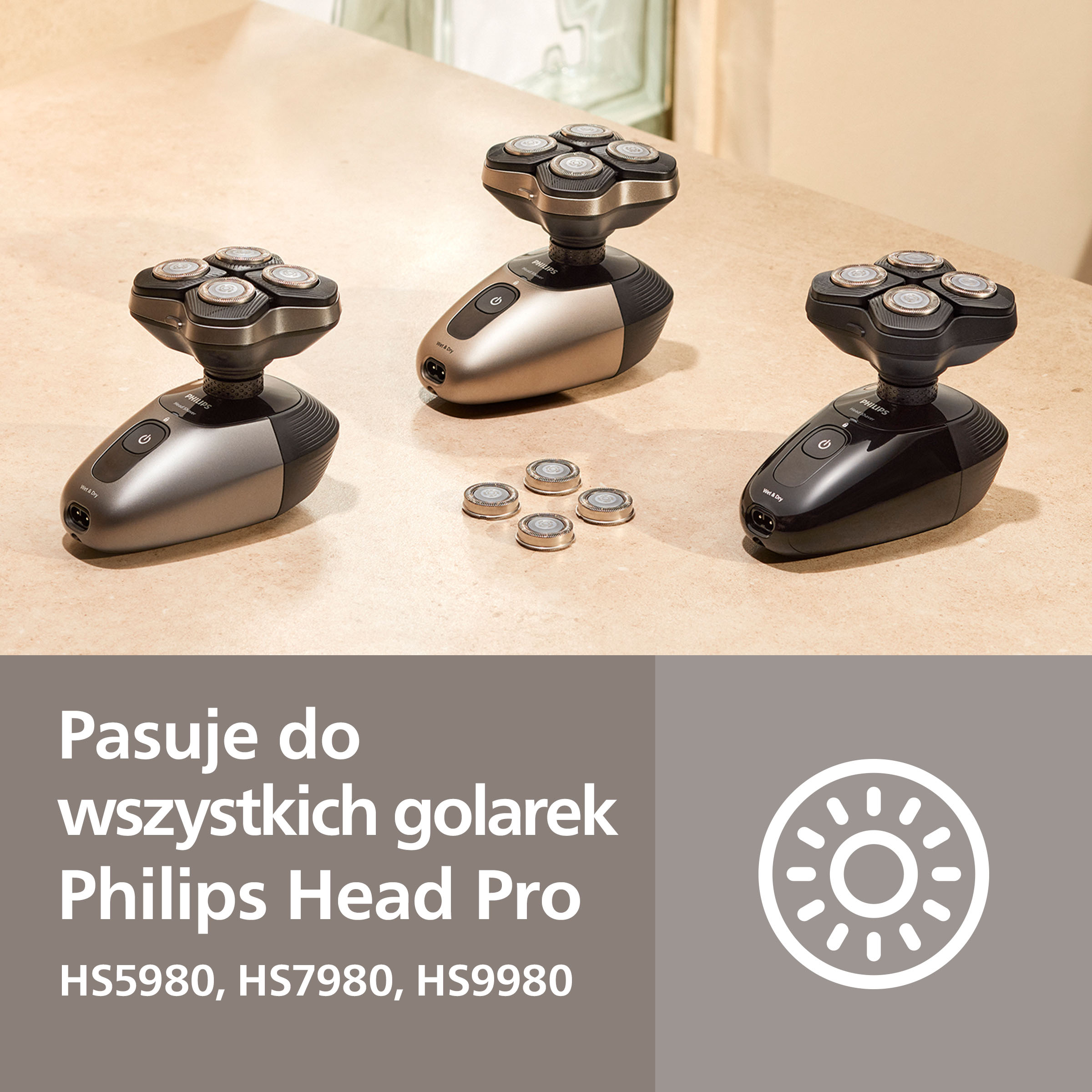 Trzy golarki Philips w kolorach czarnym, szarym i brązowym z częściami zamiennymi.