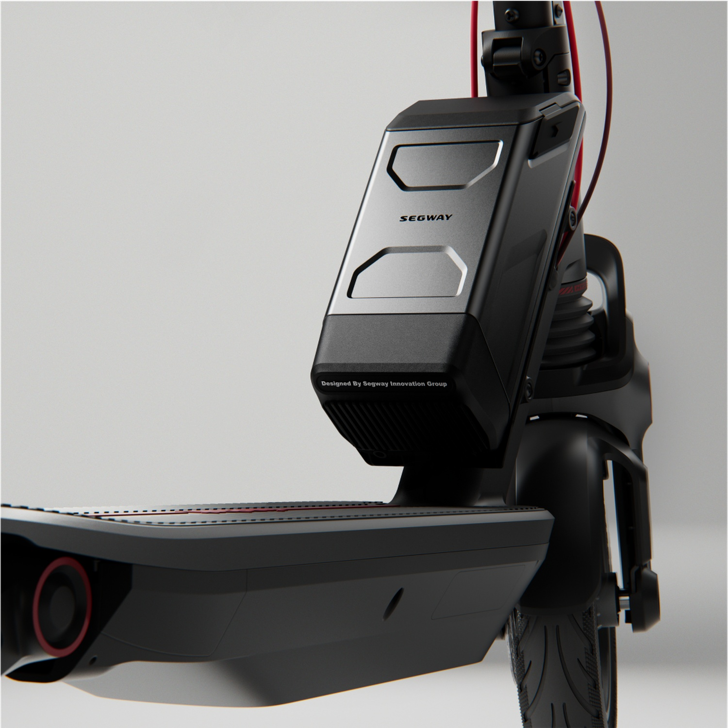 Close-up of a black electric scooter with Segway logo on its casing.