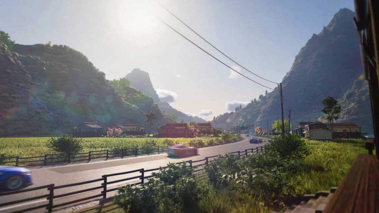 Autos fahren auf einer Straße in einer bergigen Landschaft mit Häusern.