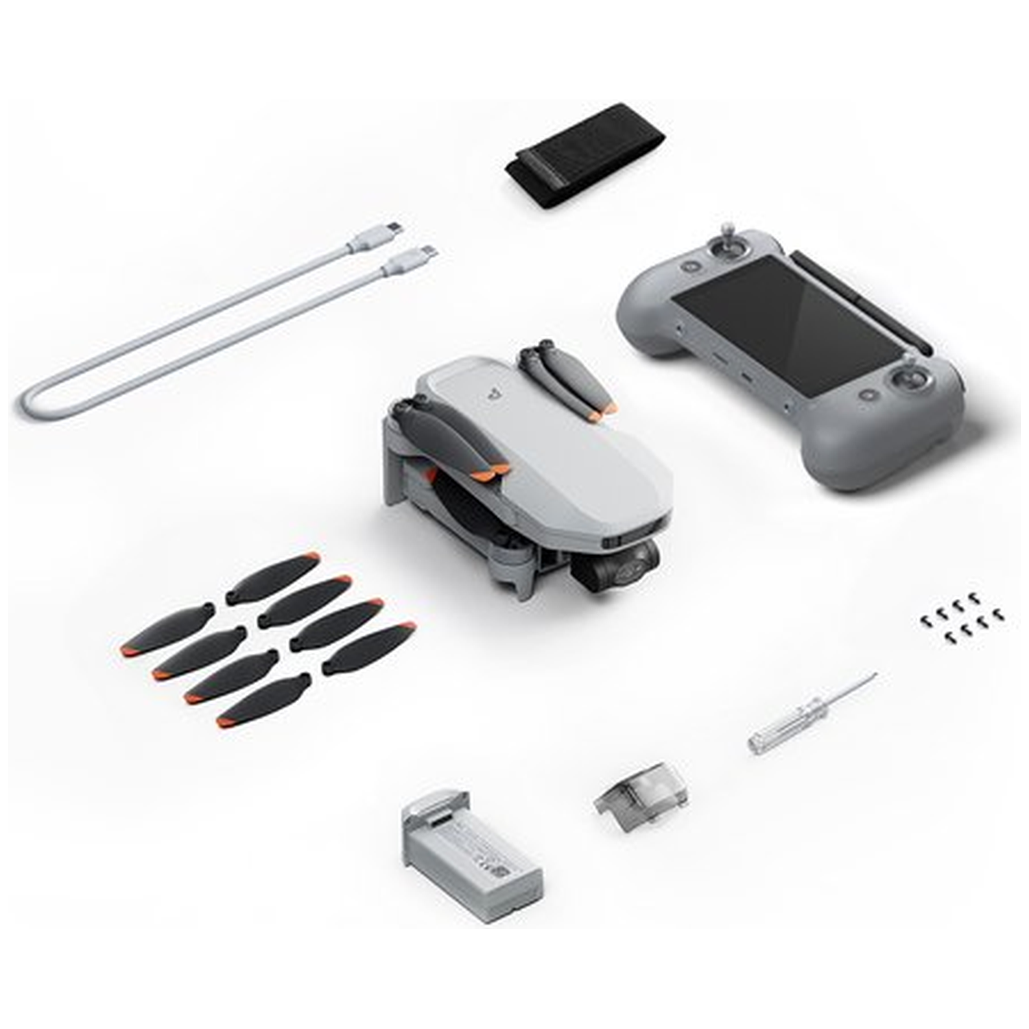 Drone, remote, cables, battery, and propellers on a white background.