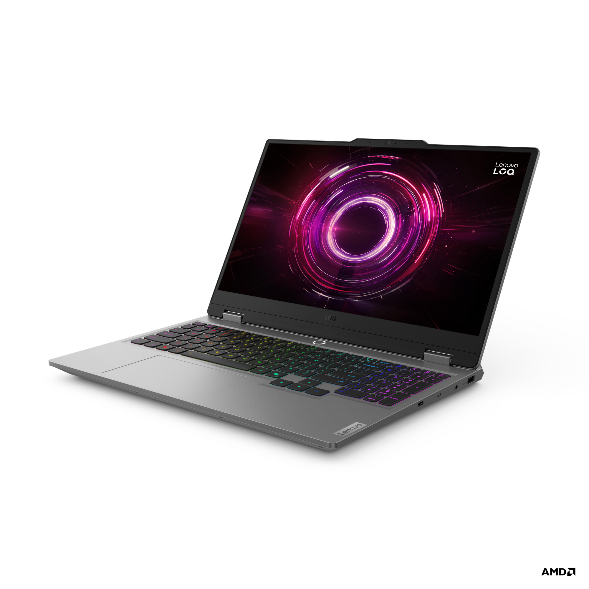 Ein silberner Laptop mit farbiger Tastatur und einem leuchtenden Kreis auf dem Bildschirm.