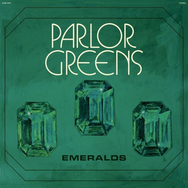 Drei grüne Smaragde auf dunklem Grün. Oben steht "PARLOR GREENS", unten "EMERALDS".