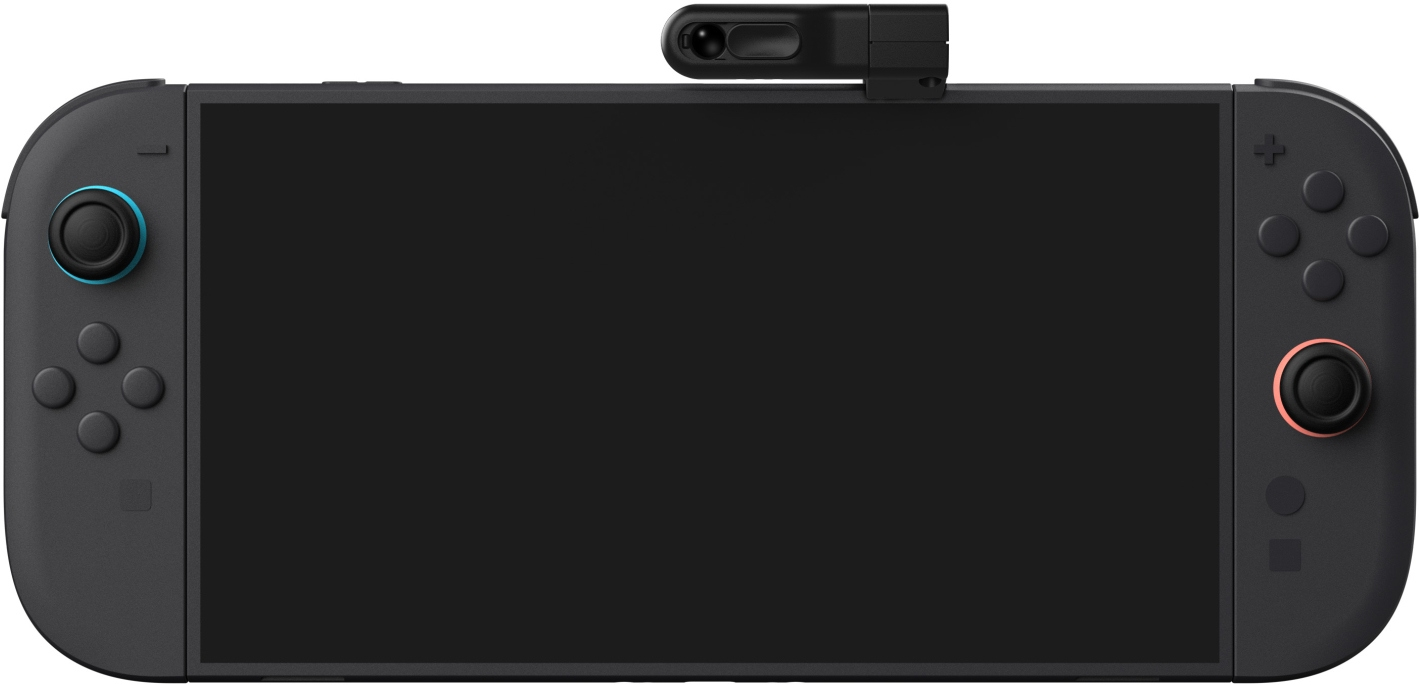 Nintendo Switch noire avec module caméra sur le dessus.