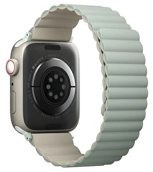 Srebrny zegarek Apple Watch z jasnozielonym paskiem, tyłem do dołu.