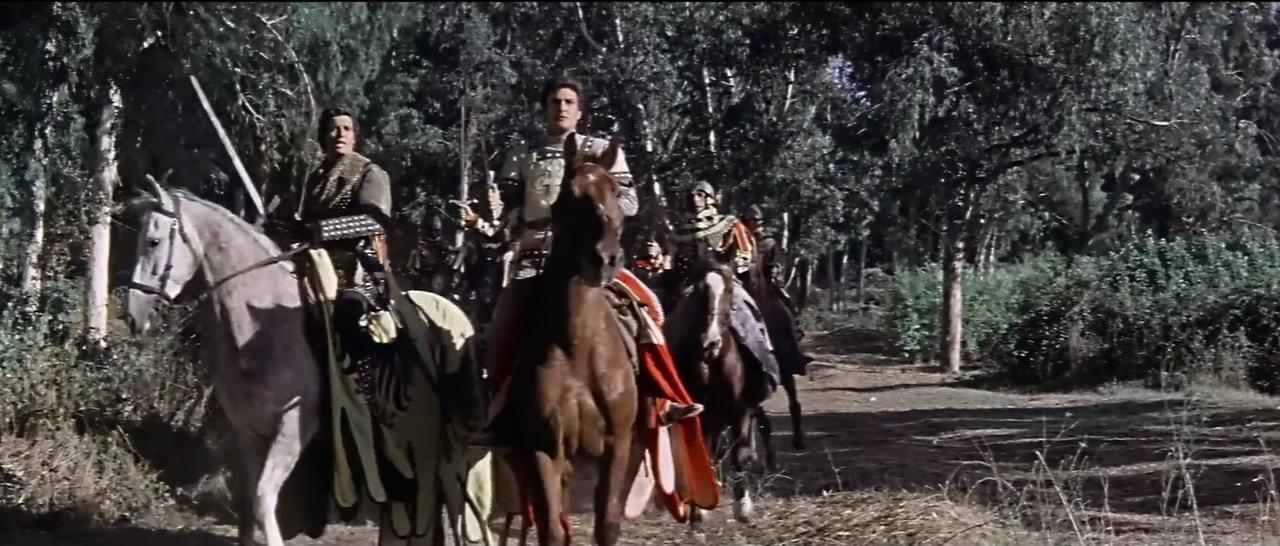Ritter auf Pferden reiten durch einen Wald, bewaffnet mit Schwertern.
