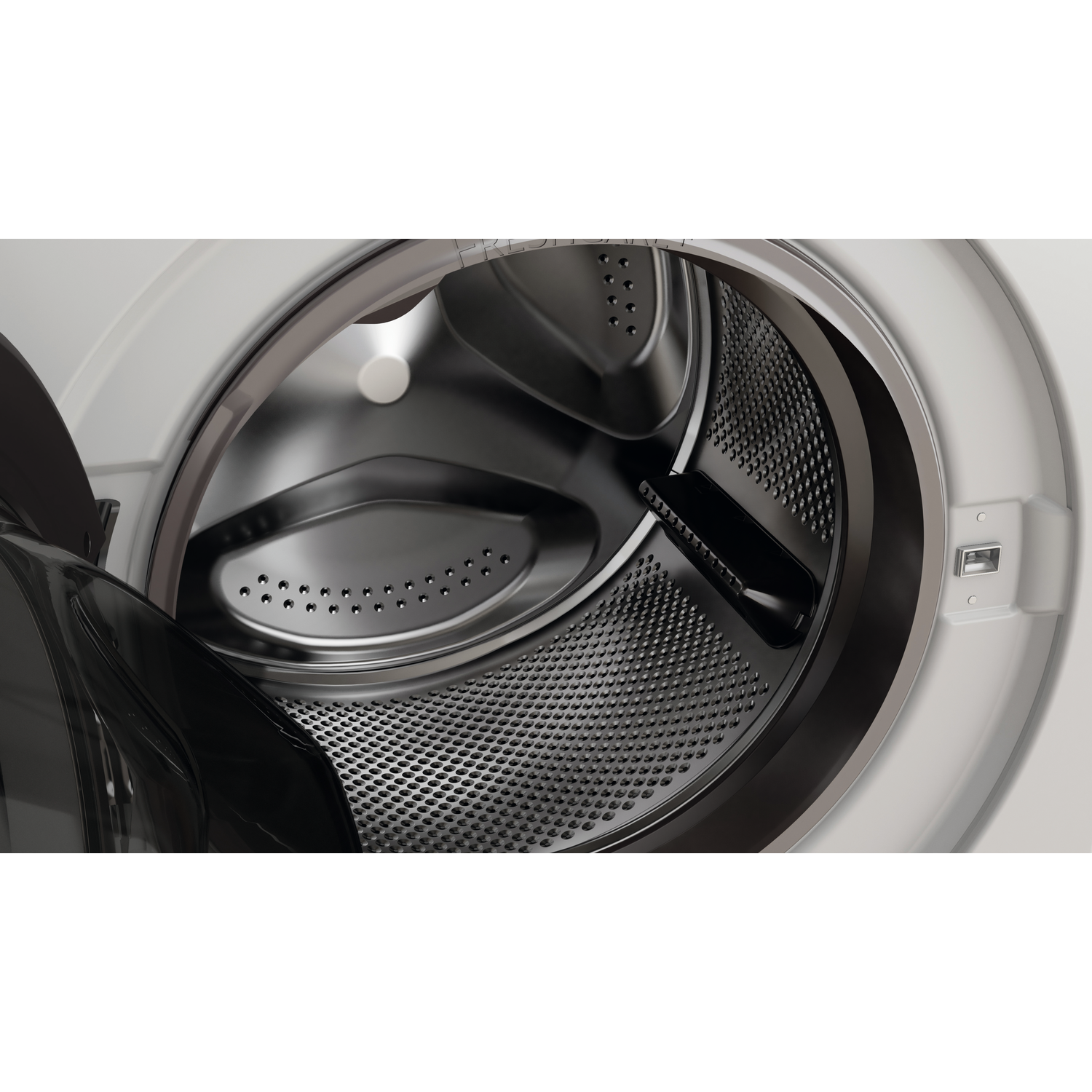 Close-up view of a washing machine drum with the door open, made of metal.
