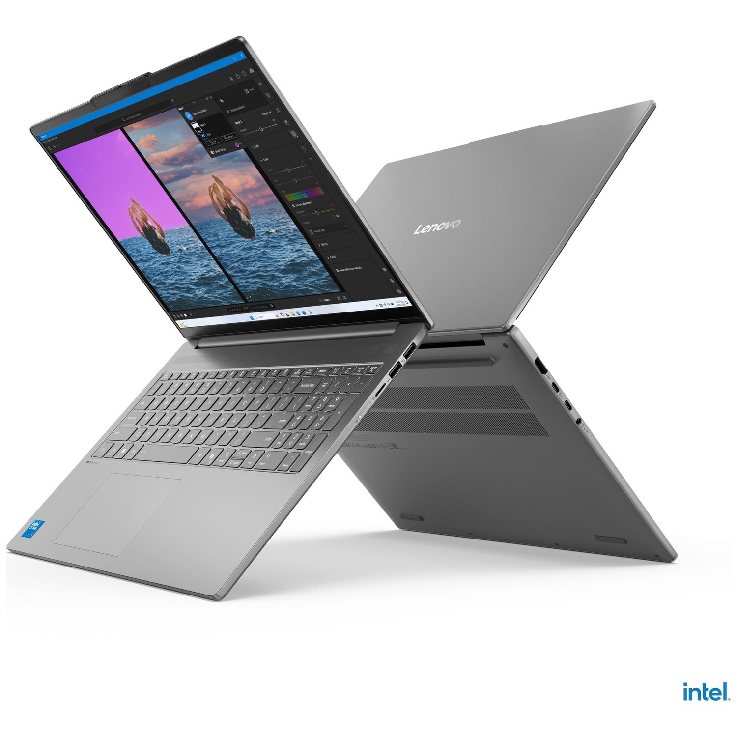 A gray Lenovo laptop with its screen open, displaying photo editing software.