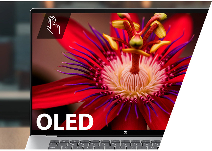 A laptop displays a macro of a red passion flower with the word OLED.