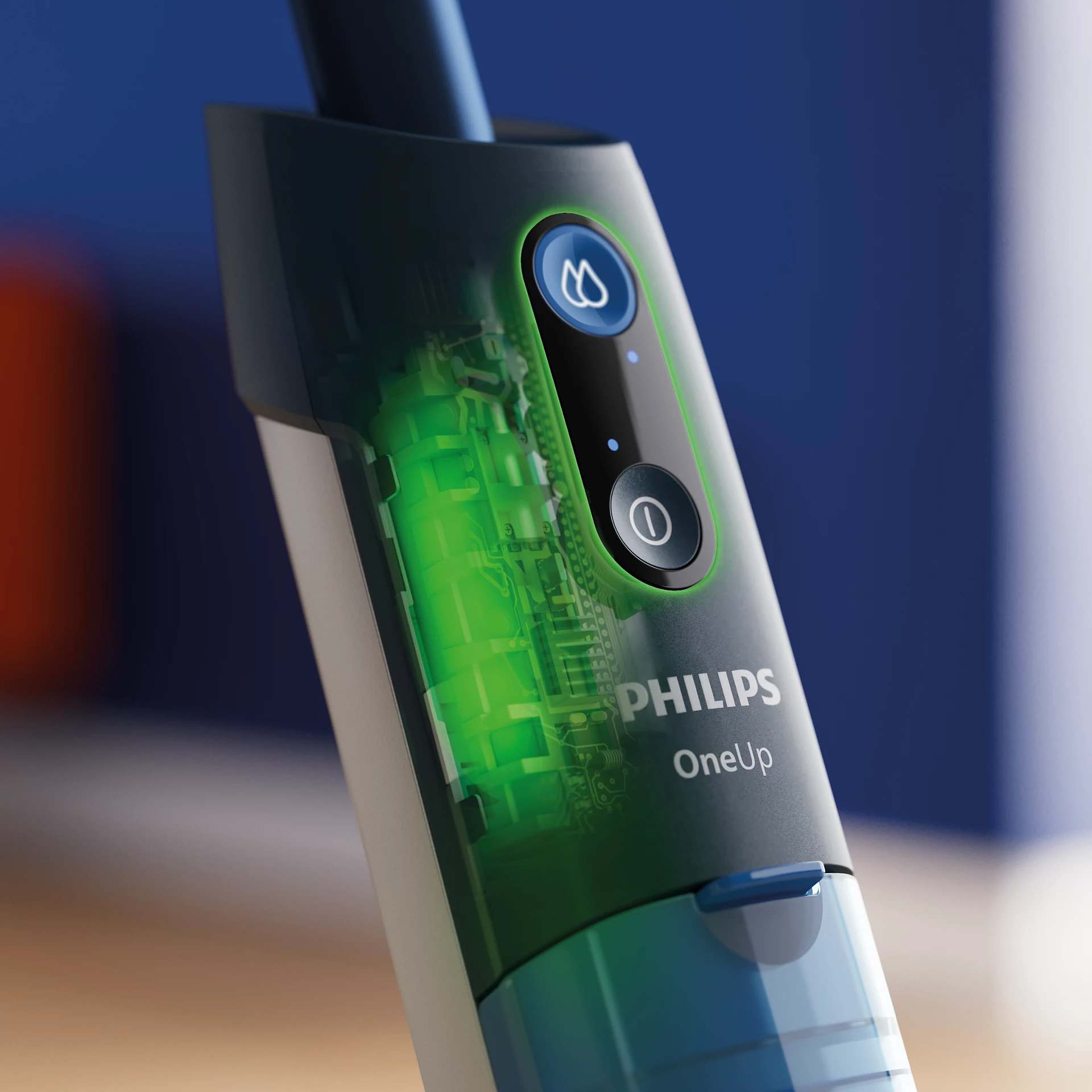 Zöld akkumulátor, áramkör és Philips OneUp logó közeli felvétele.