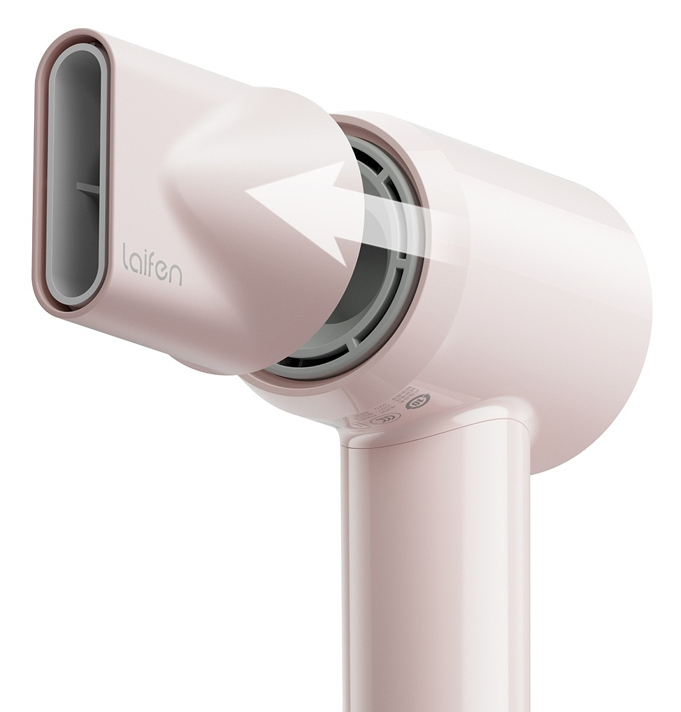 Różowa suszarka do włosów z białym wskaźnikiem kierunku przepływu powietrza.