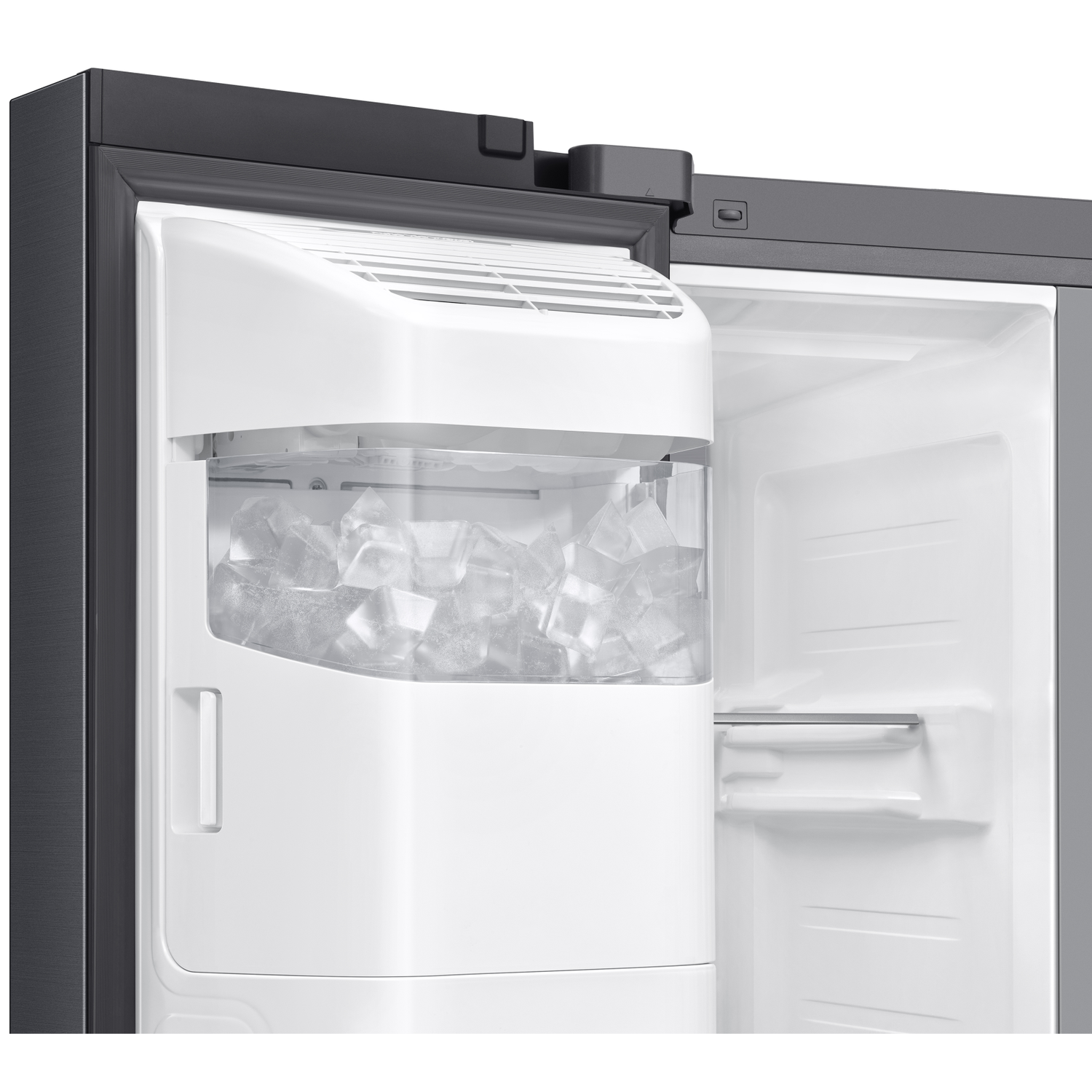Freezer with ice cubes in a clear bin and open door.