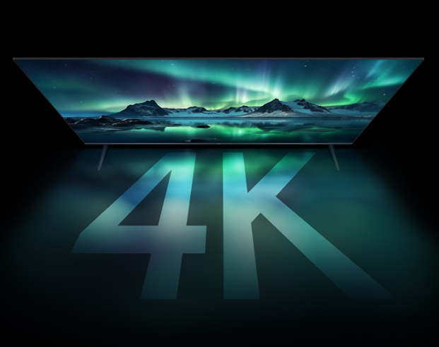 A 4K TV displays the Northern Lights over mountains and water.