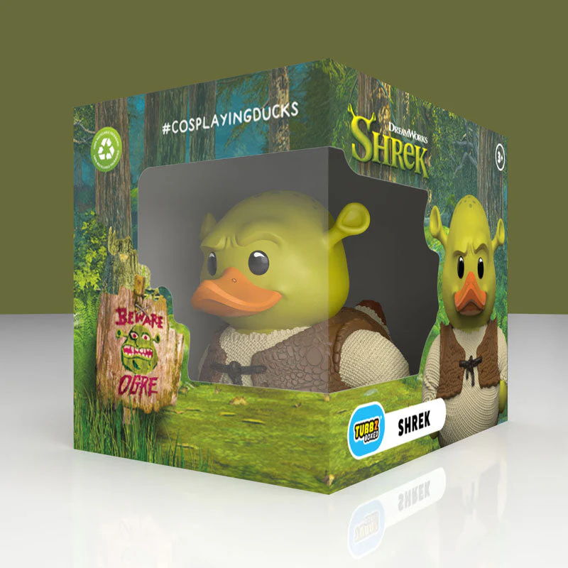 Shrek kacsafigura erdei csomagolásban, figyelmeztető táblával.