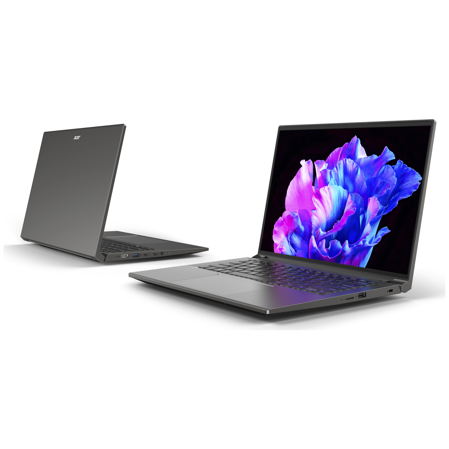 Two gray laptops on white, one open showing a colorful flower wallpaper.