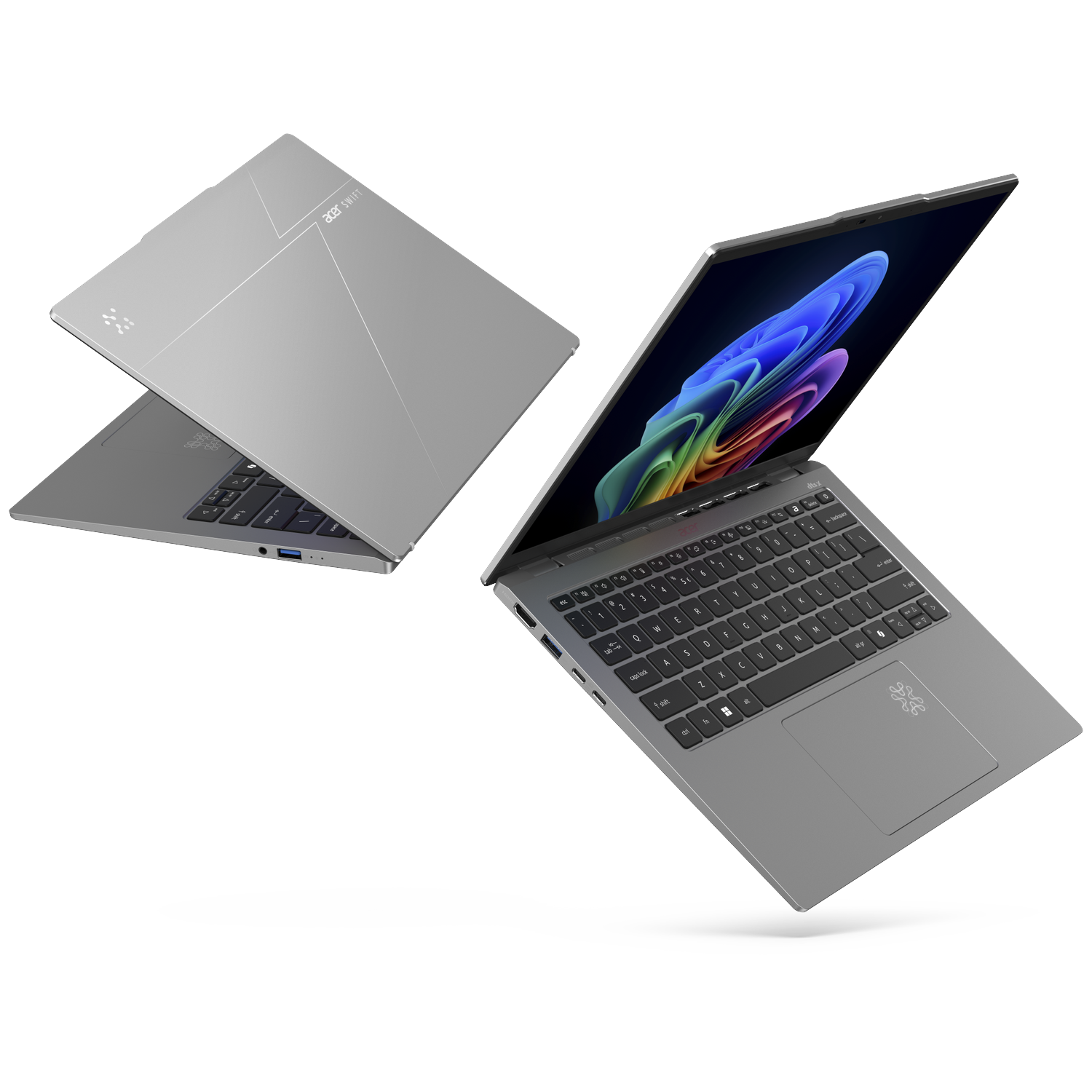 Two silver Acer Swift laptops, one open showing a colorful screen, one closed.