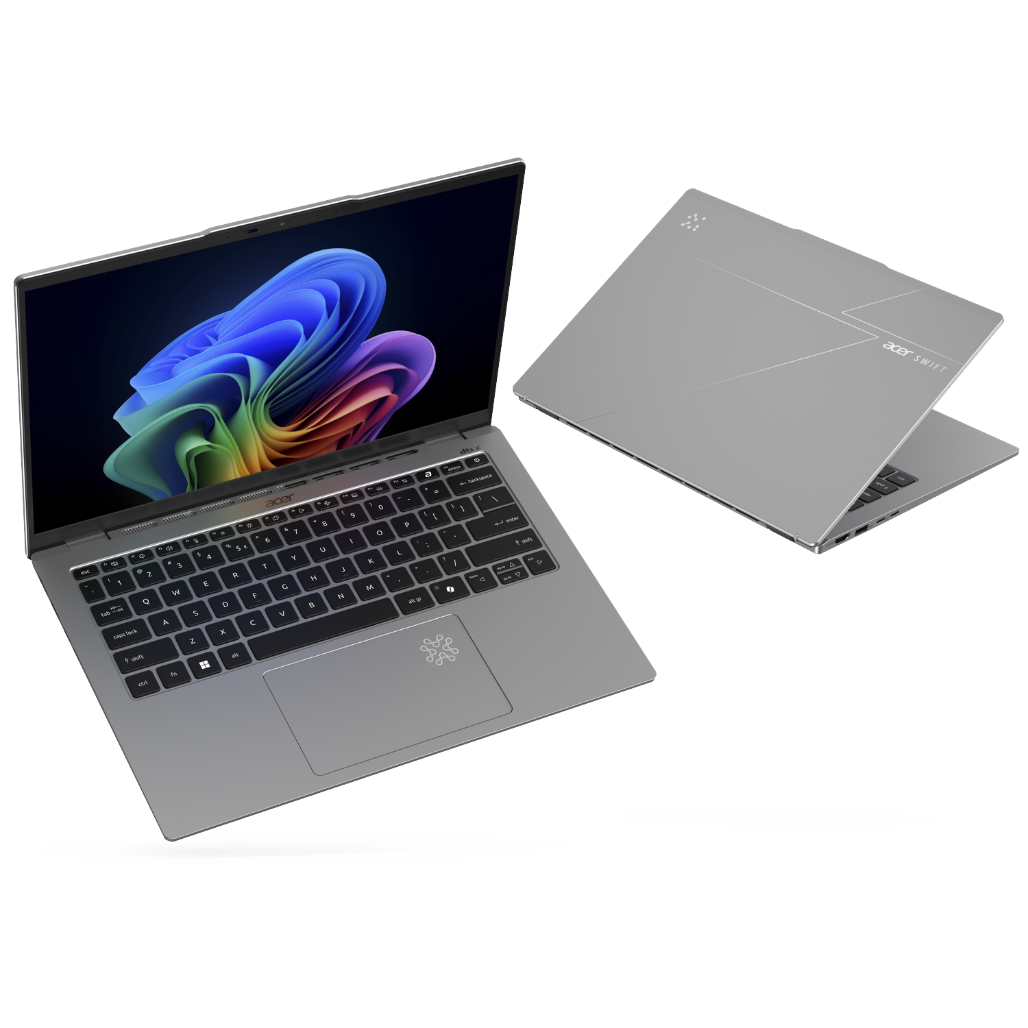 Two silver Acer Swift laptops, one open showing colorful wallpaper, one closed.