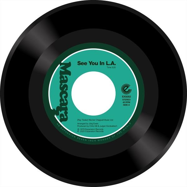 Schwarze Vinyl-Schallplatte mit türkisfarbenem Etikett und weißem Zentrum.