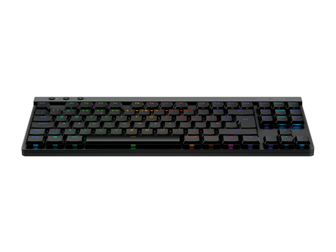 Egy fekete, RGB világítású mechanikus billentyűzet látható zöld háttéren.