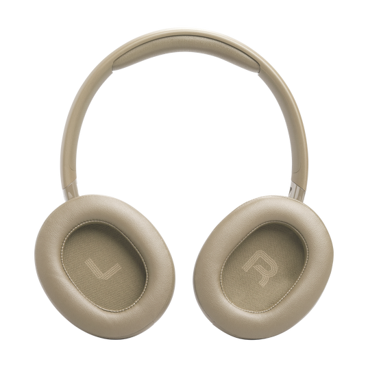 Beżowe słuchawki z oznaczeniami L i R na nausznikach.