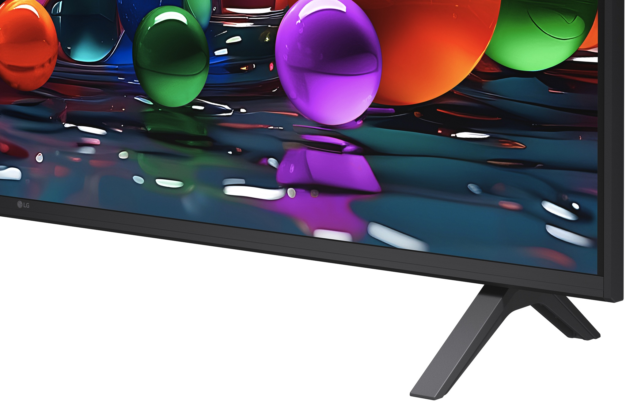Ekran telewizora LG pokazuje kolorowe kule na błyszczącej powierzchni.