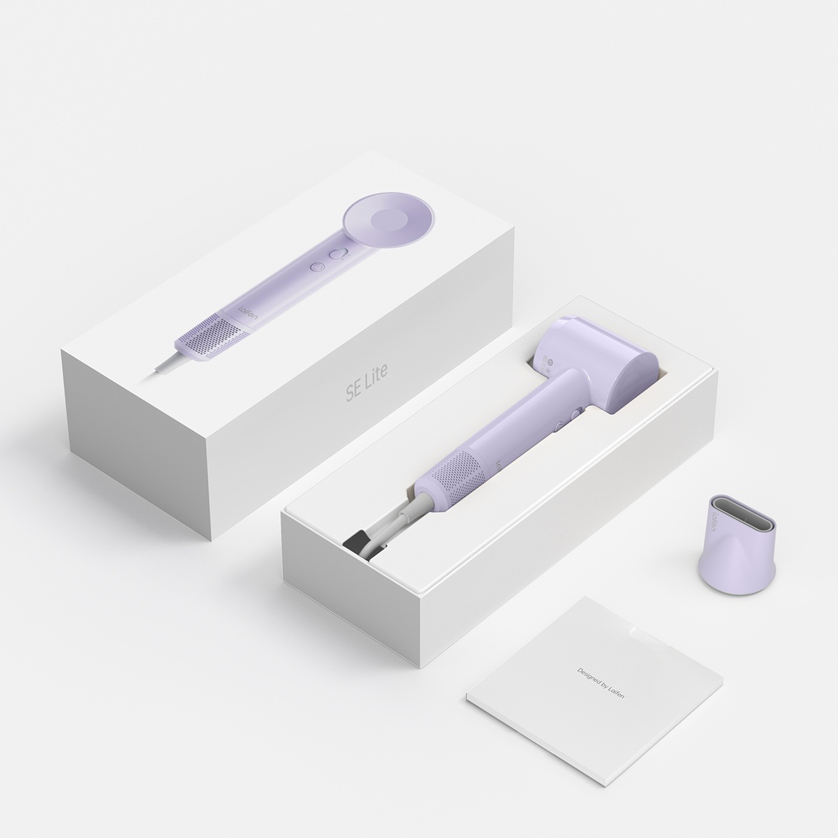 Fioletowa suszarka do włosów w białym pudełku, obok inne urządzenie i instrukcja.