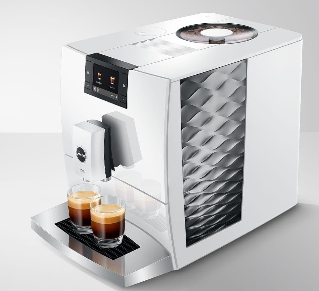 Biała maszyna do kawy z dwoma szklankami espresso z przodu.