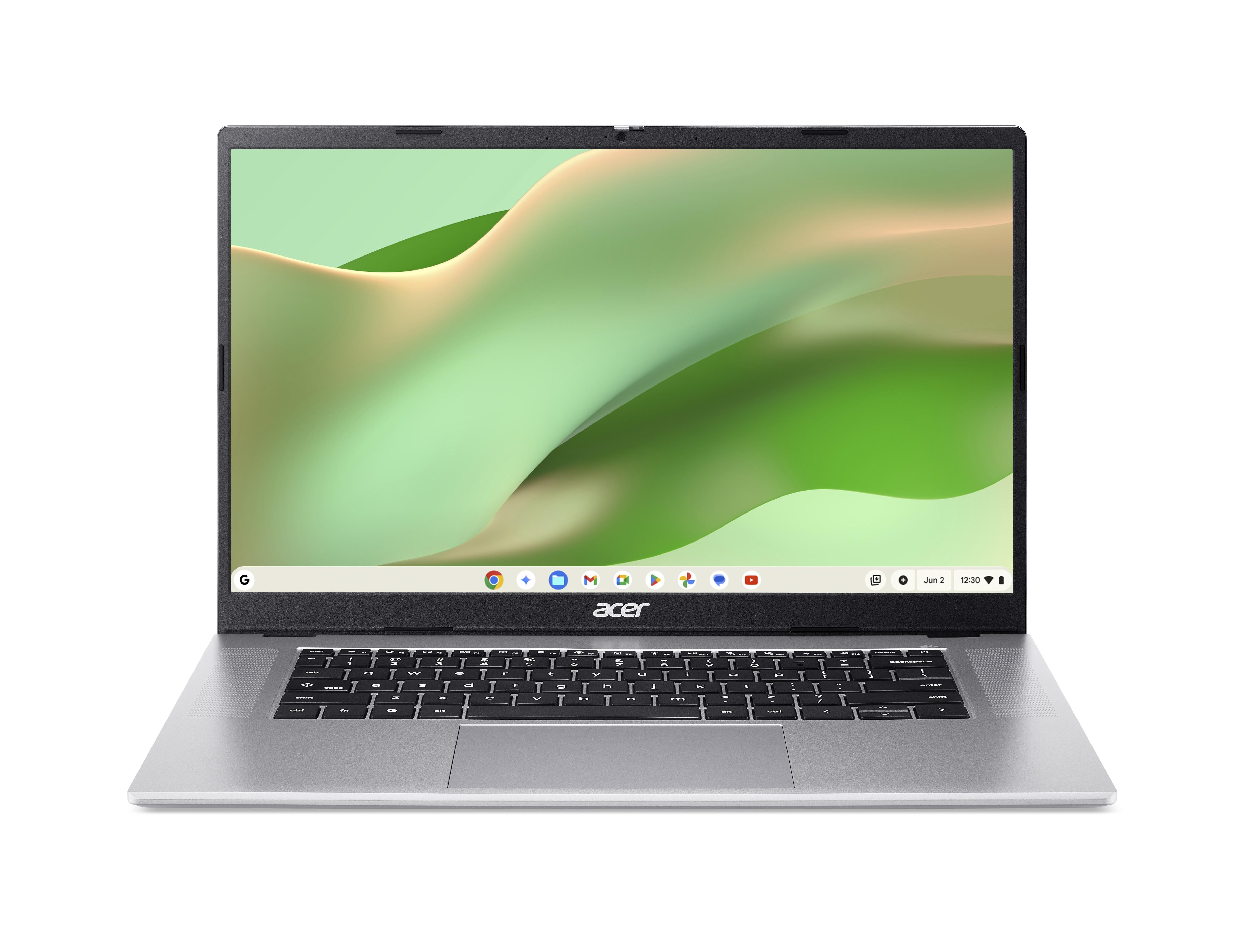 Ein silberner Acer Laptop mit schwarzer Tastatur und grünem Hintergrundbild.
