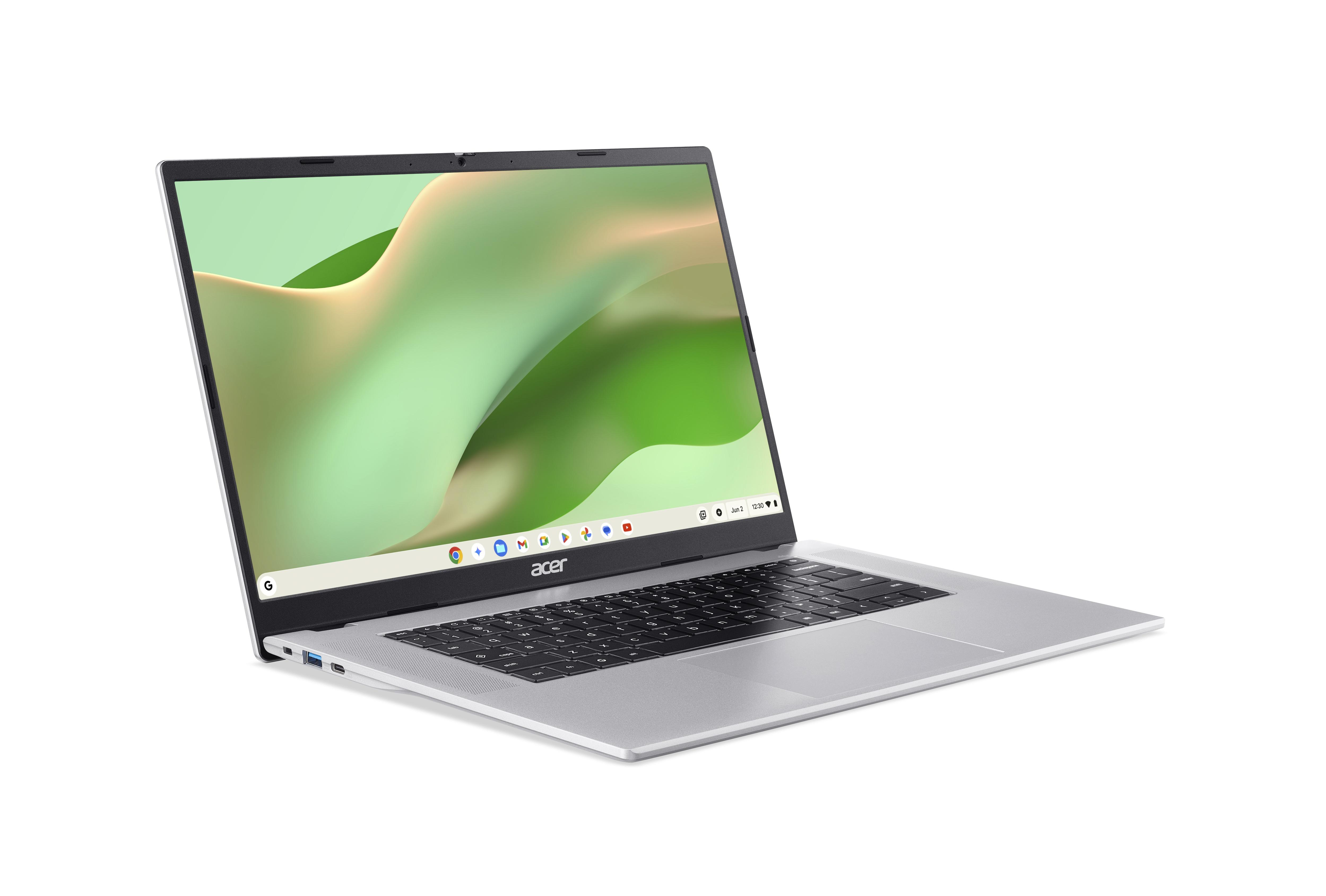 Ein silberner Acer Laptop mit einem grünen Hintergrund auf dem Bildschirm.