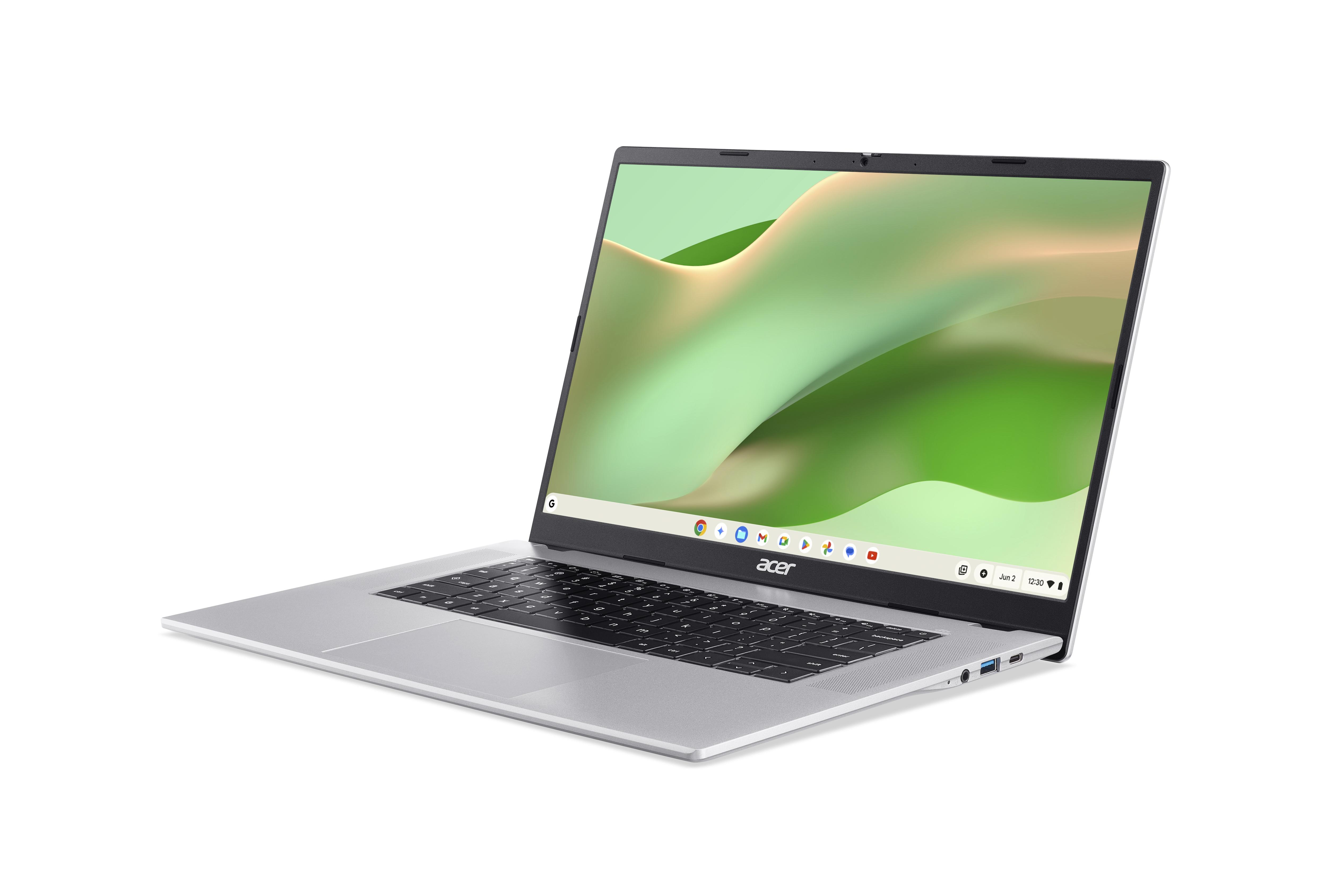 Ein silberner Acer Laptop mit Tastatur und Bildschirm, der einen grünen Hintergrund zeigt.