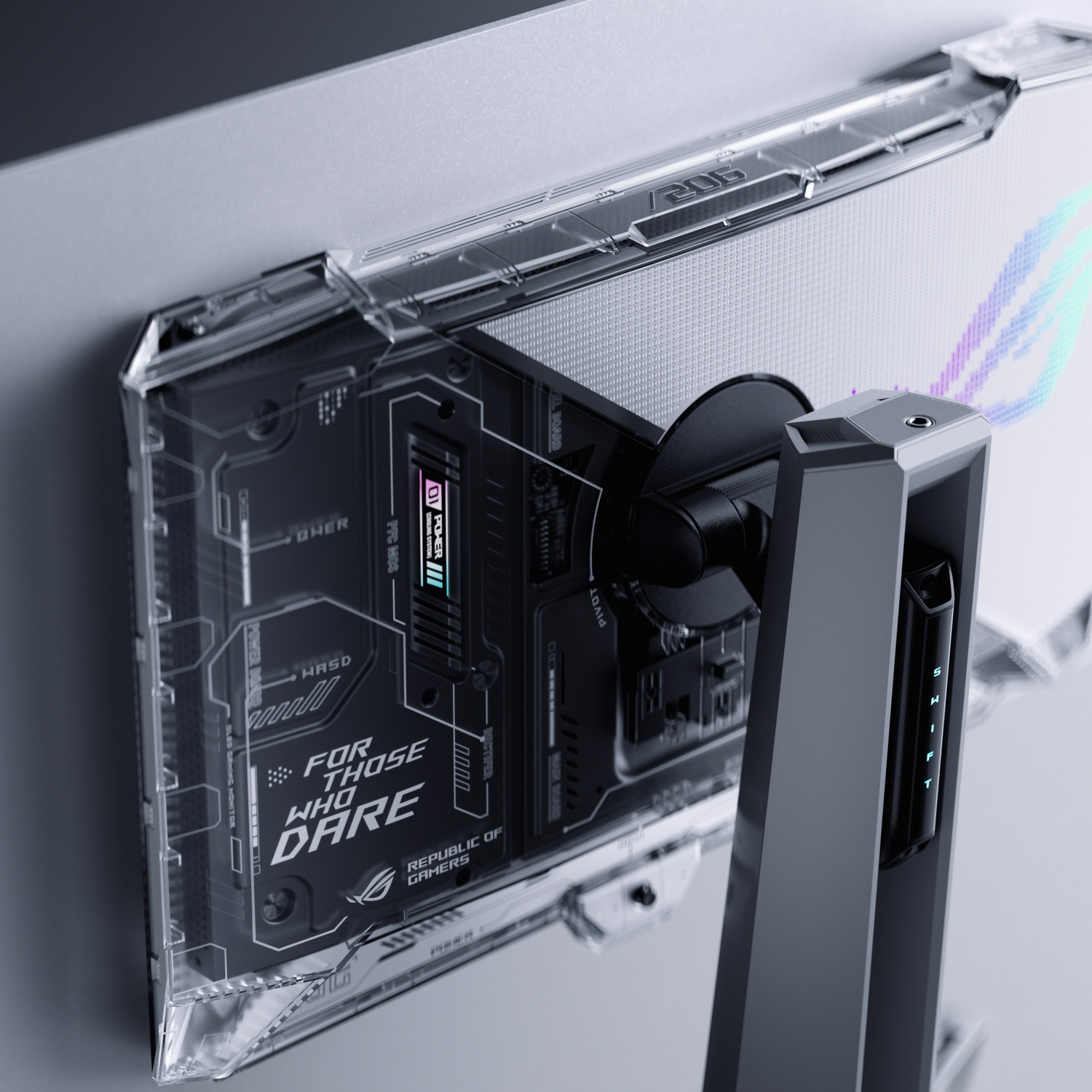 Achterkant van een gamingmonitor met transparante behuizing, met interne componenten en 'FOR THOSE WHO DARE'-logo.