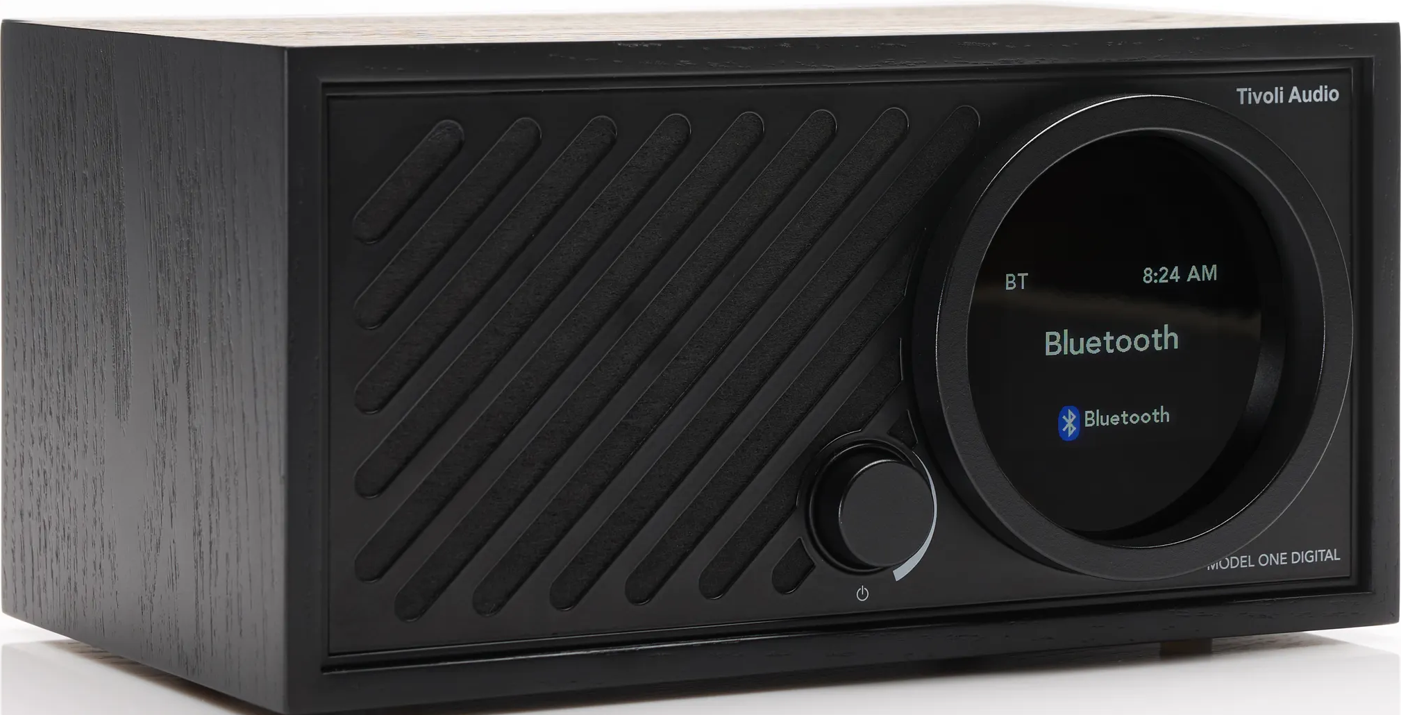 Schwarzer Tivoli Audio Tischradio mit kreisförmigem Display, das Bluetooth anzeigt.