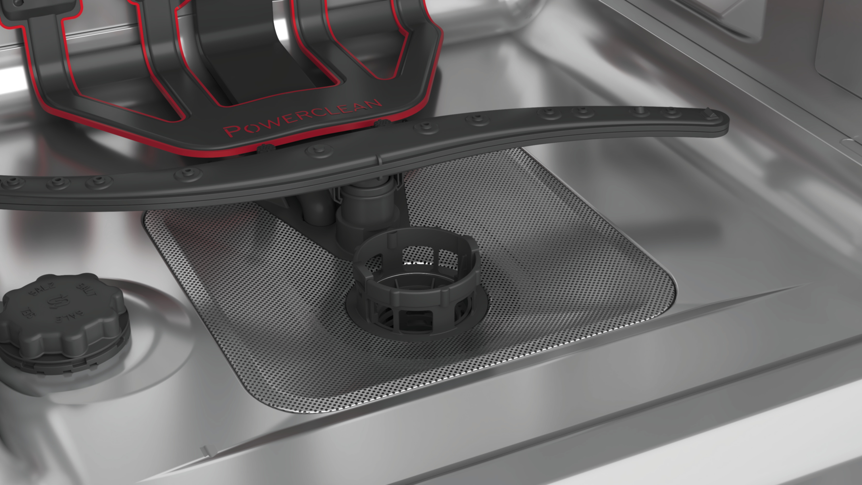 Zbliżenie wnętrza zmywarki z ramieniem natryskowym i filtrem.