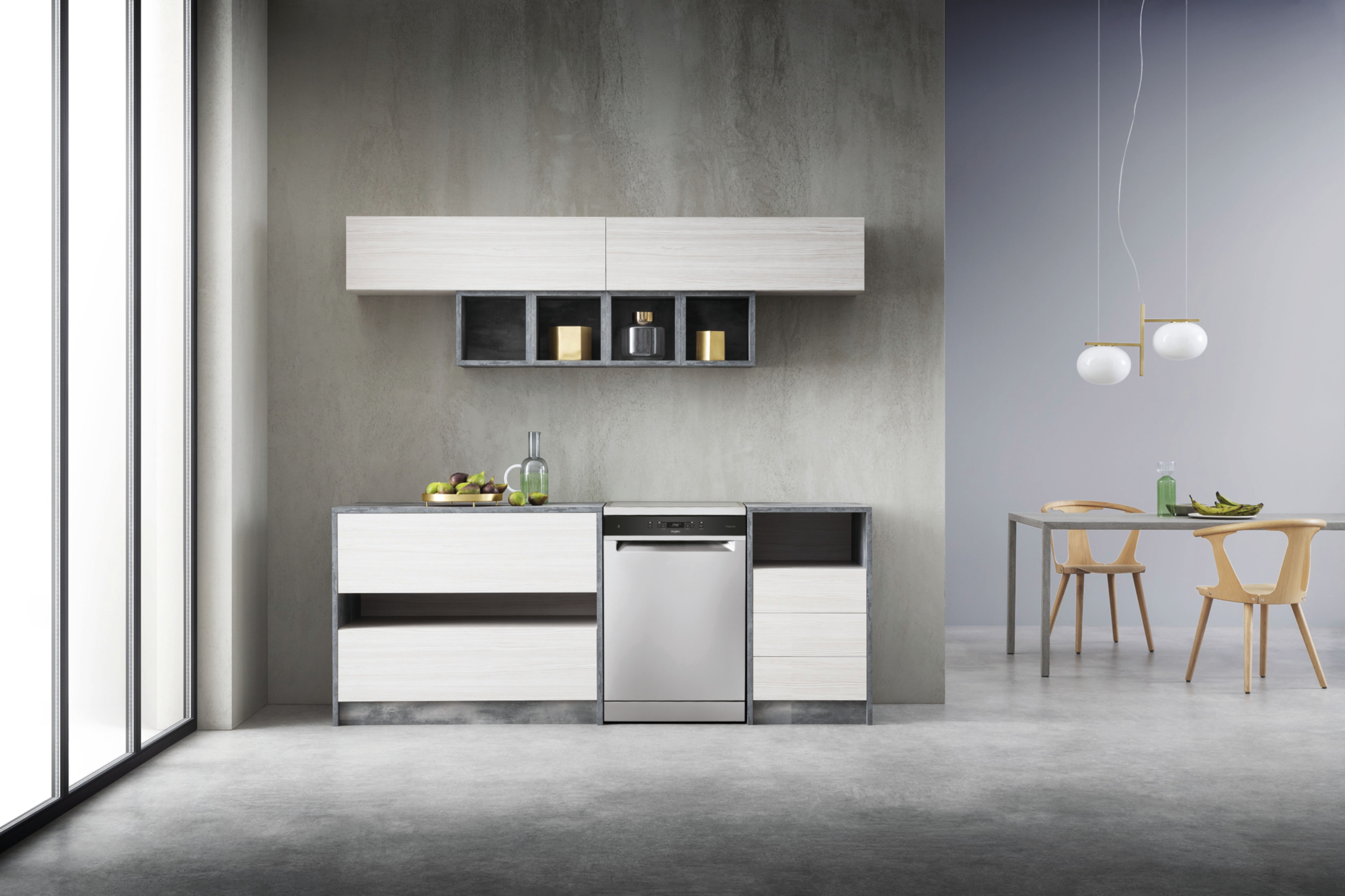 Nowoczesna kuchnia z betonowymi ścianami, sprzętem AGD i jadalnią.