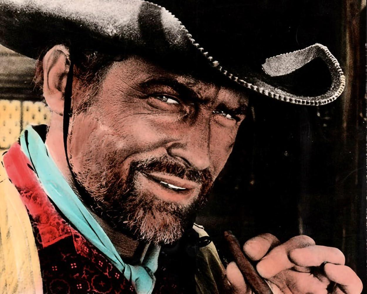 Ein Mann mit Hut und blauem Halstuch raucht eine Zigarre.