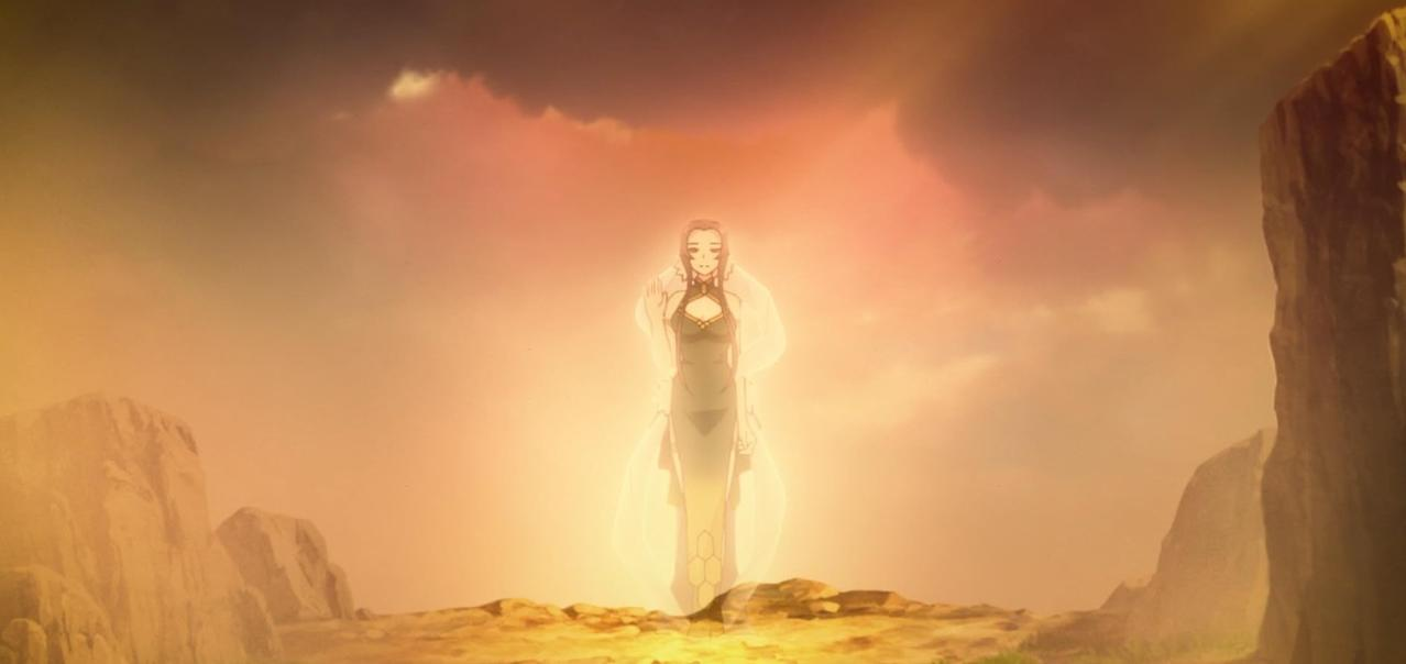 Eine Frau in einem grünen Kleid steht in hellem Licht vor einer felsigen Landschaft.