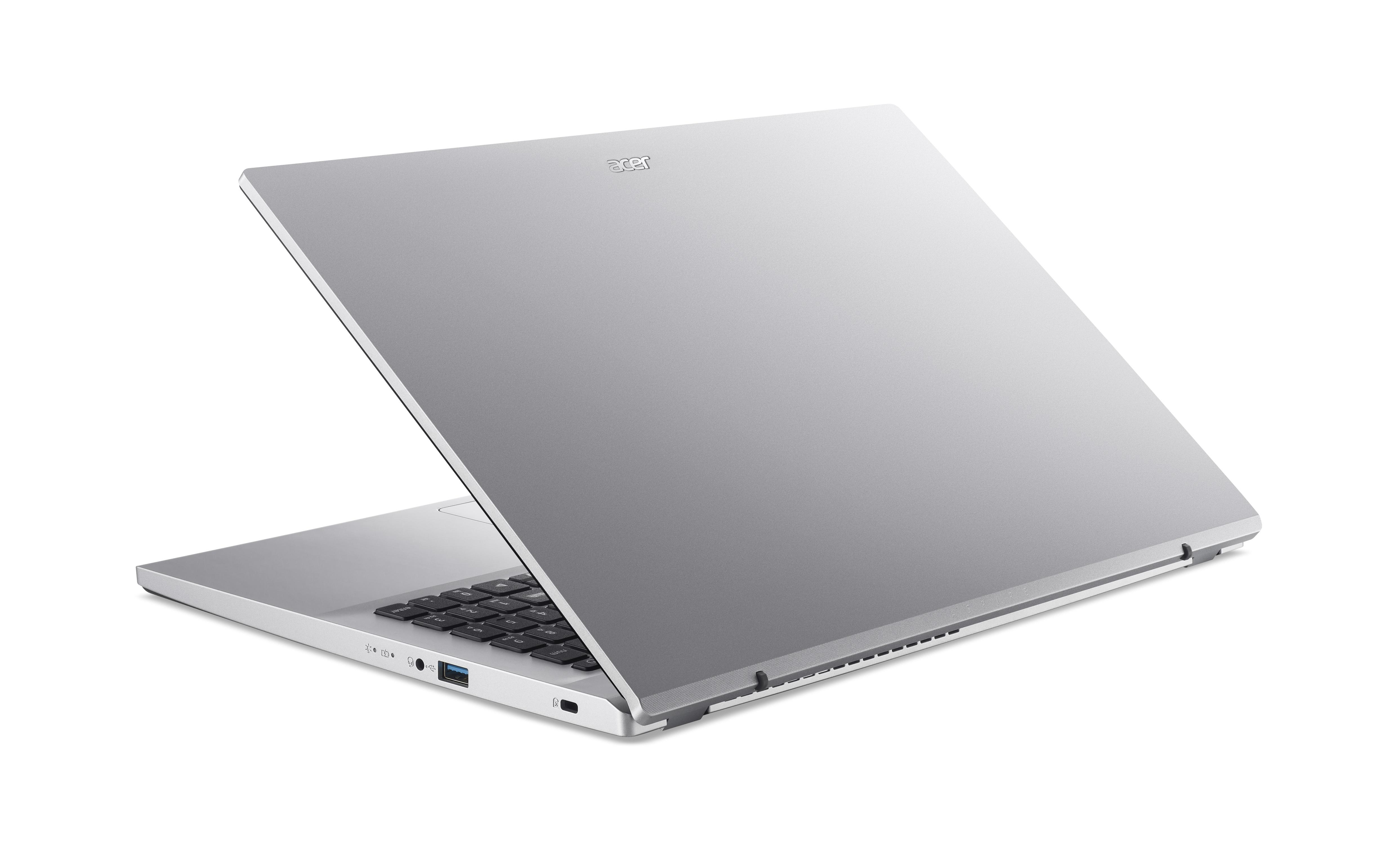 Ein silberner Acer Laptop ist geöffnet, mit Blick auf die Tastatur und Anschlüsse.